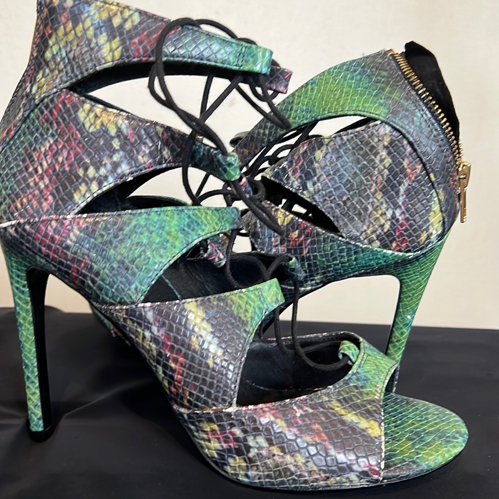 Never worn green snake skin tie up on the front and zip in the back 4 in heels.